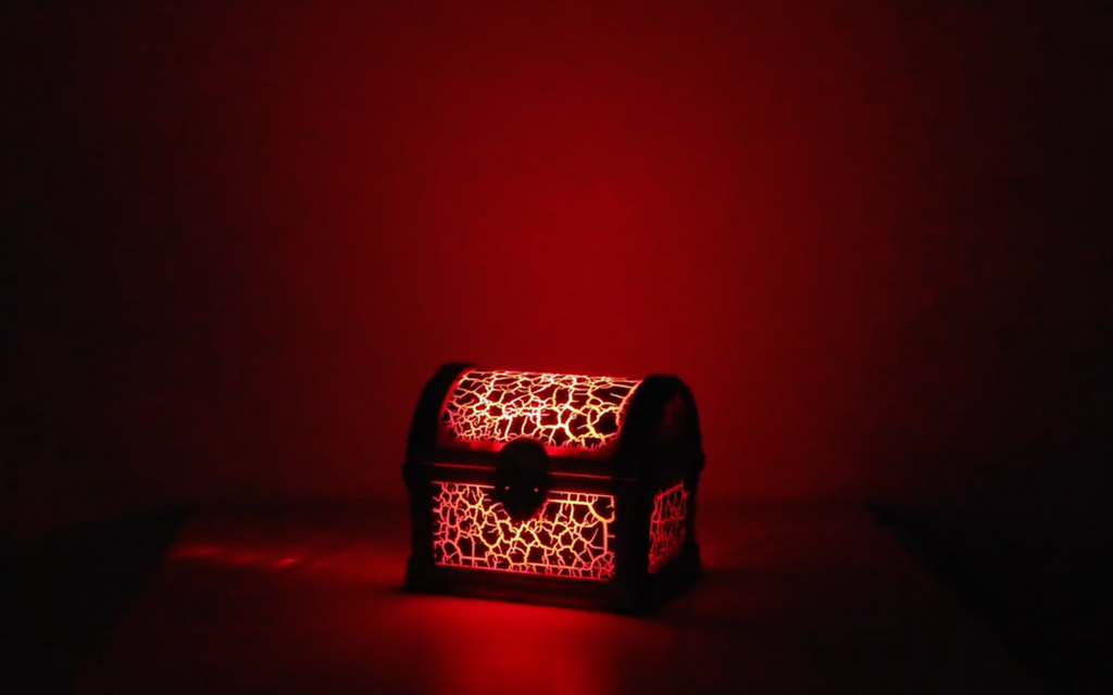 Decorative chest with intricate patterns on a dark background